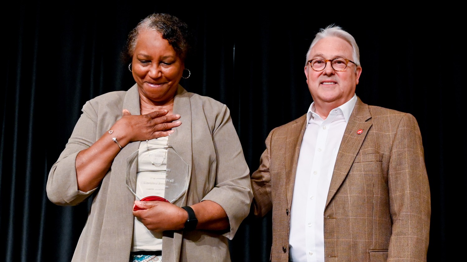 Chancellor Randy Woodson (right) congratulates Carolyn Wall (left), a student services manager in Enrollment Management and Services, for achieving 40 years of service at NC State. The university recently hosted two events to honor employees who reached five-year service milestones.