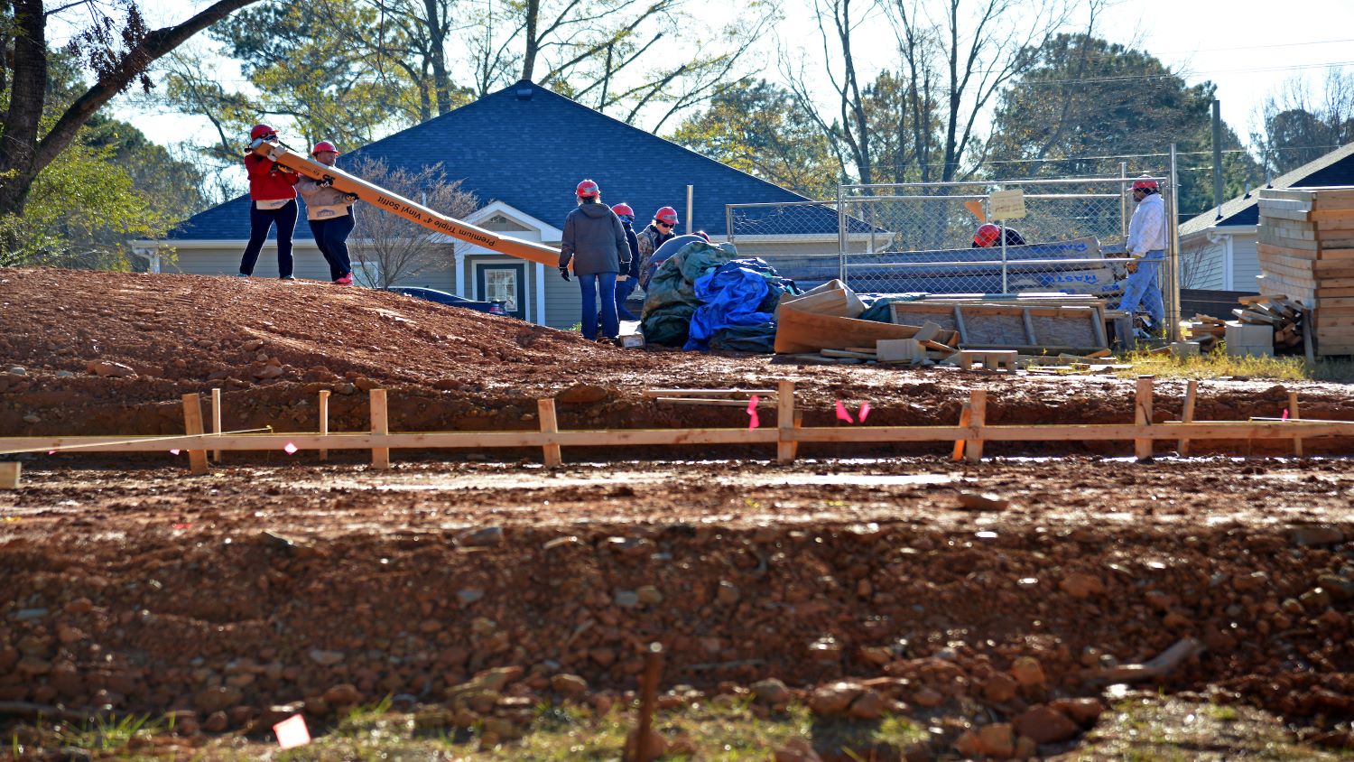Staff members from the Division of Academic and Student Affairs and Facilities Division participate in a Build-A-Block Habitat for Humanity project in 2016.