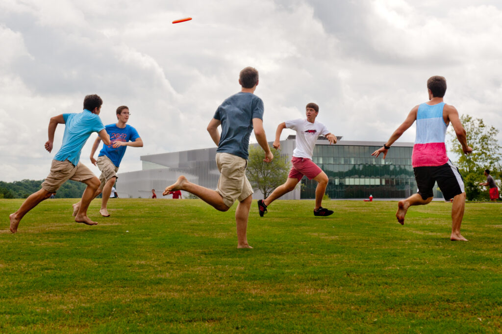 Students enjoying a frisbee game