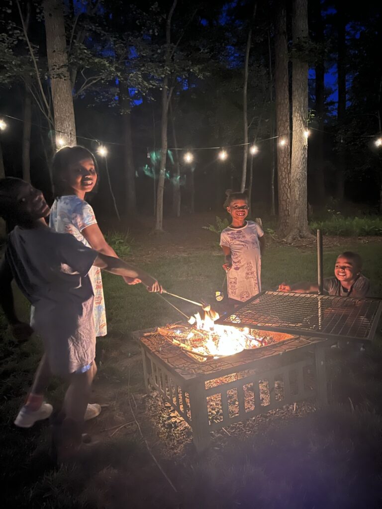 A picture of faculty member Zakiya Leggett's children roasting s'mores.