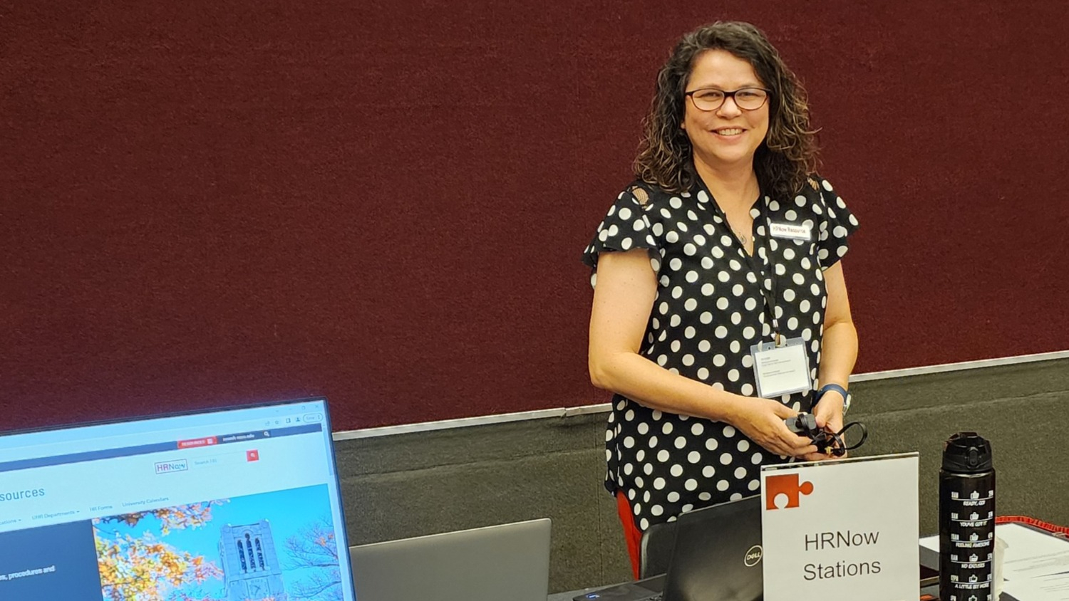 A picture of Amy Grubbs, manager of the Onboarding Center at NC State, staffing an HRNow station at at the HR Professionals Conference on July 27.