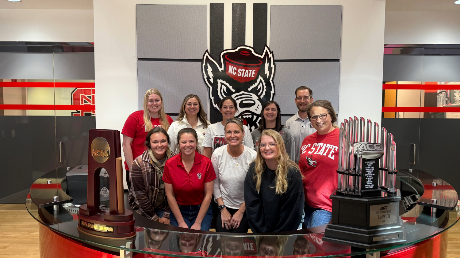 The three teams that won the 2024 Fall Wolfpack Wellness Challenge toured and took pictures in the Dail Basketball Center.