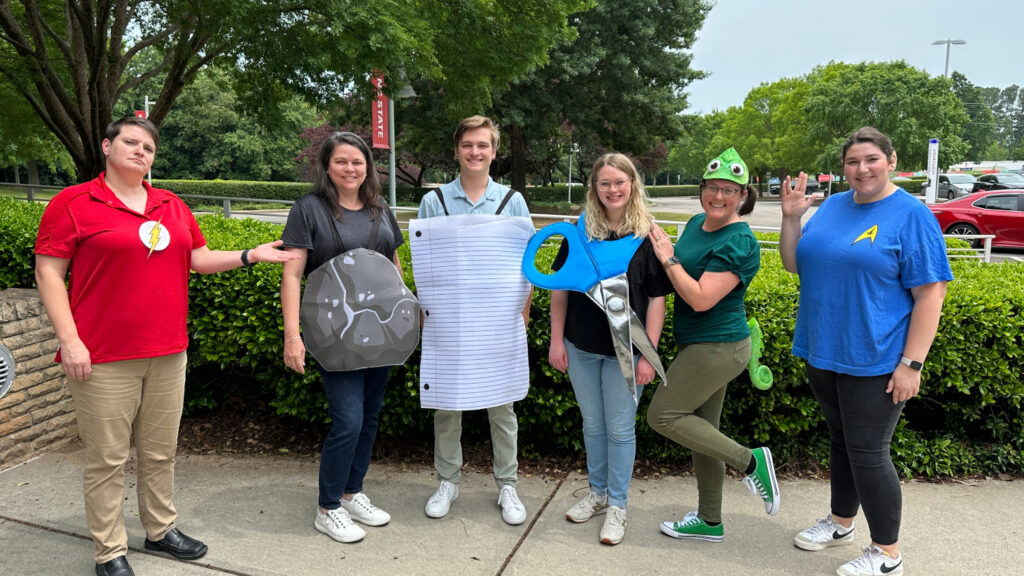Employees taking part in Team-Building Thursday by dressing up in various cosstumes.