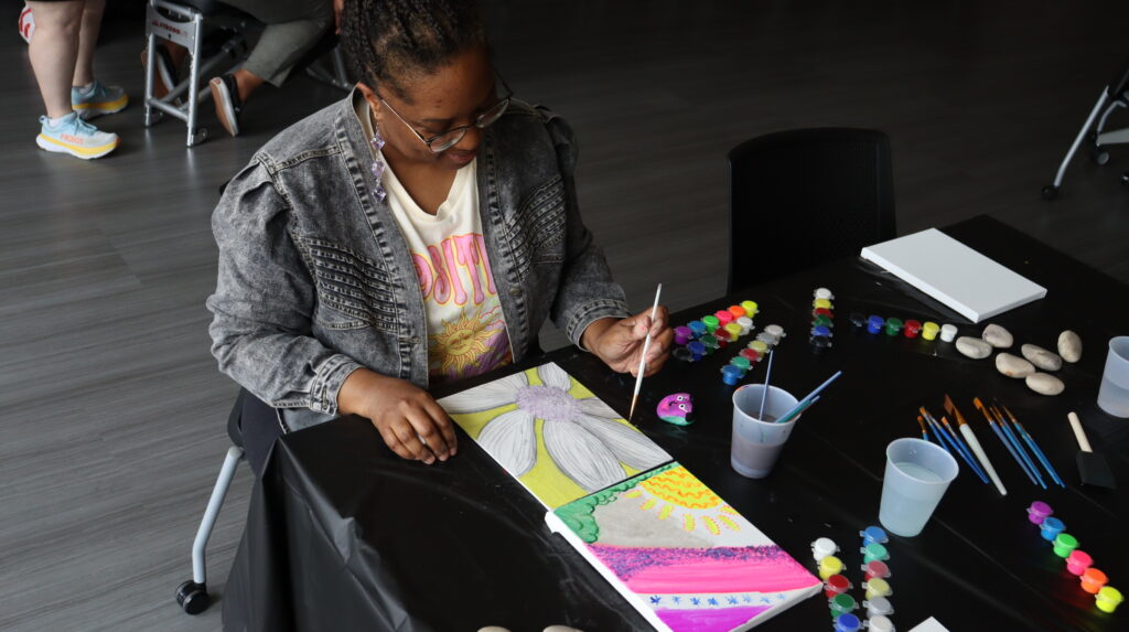 An employee participating in a Mindful Monday craft activity